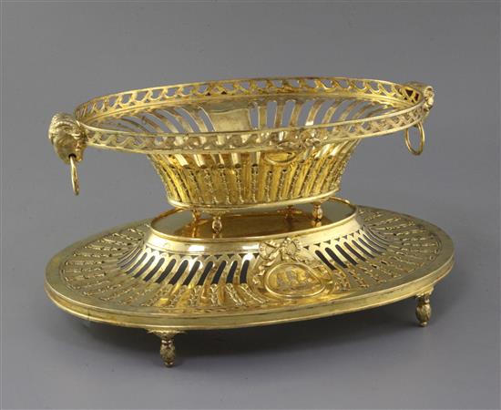 An Edwardian silver gilt dessert basket and stand by William Comyns, 69.5 oz.
